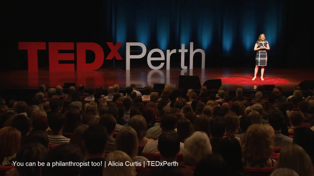 A screenshot from the TEDxPerth presentation by Alicia Curtis titled 'You Can Be a Philanthropist Too!"